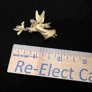 Gold tone angel pin